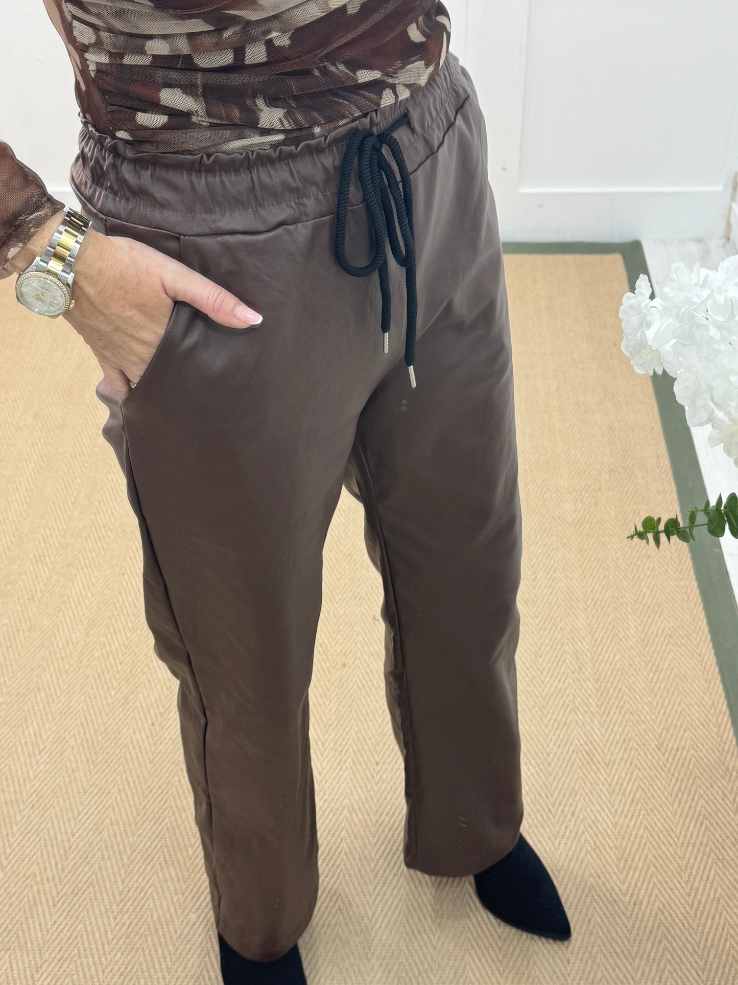 Quinn: Brown faux leather trousers. One size: 10-14