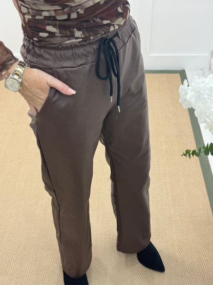 Quinn: Brown faux leather trousers. One size: 10-14