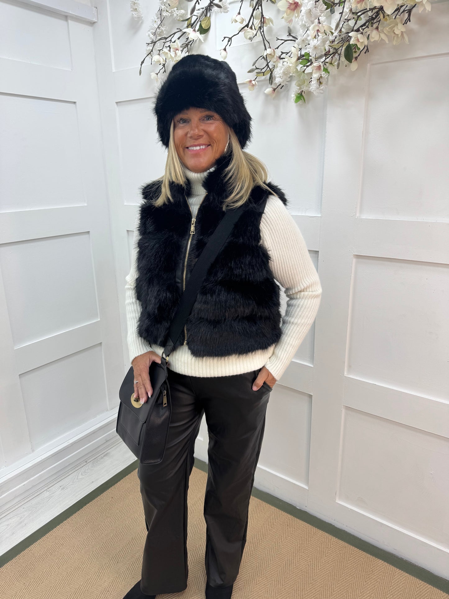 Kizzy: Black zip up faux fur gilet. One size 8-16