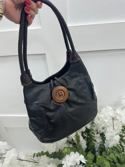 Pipa: Black slouchy big button shoulder bag.