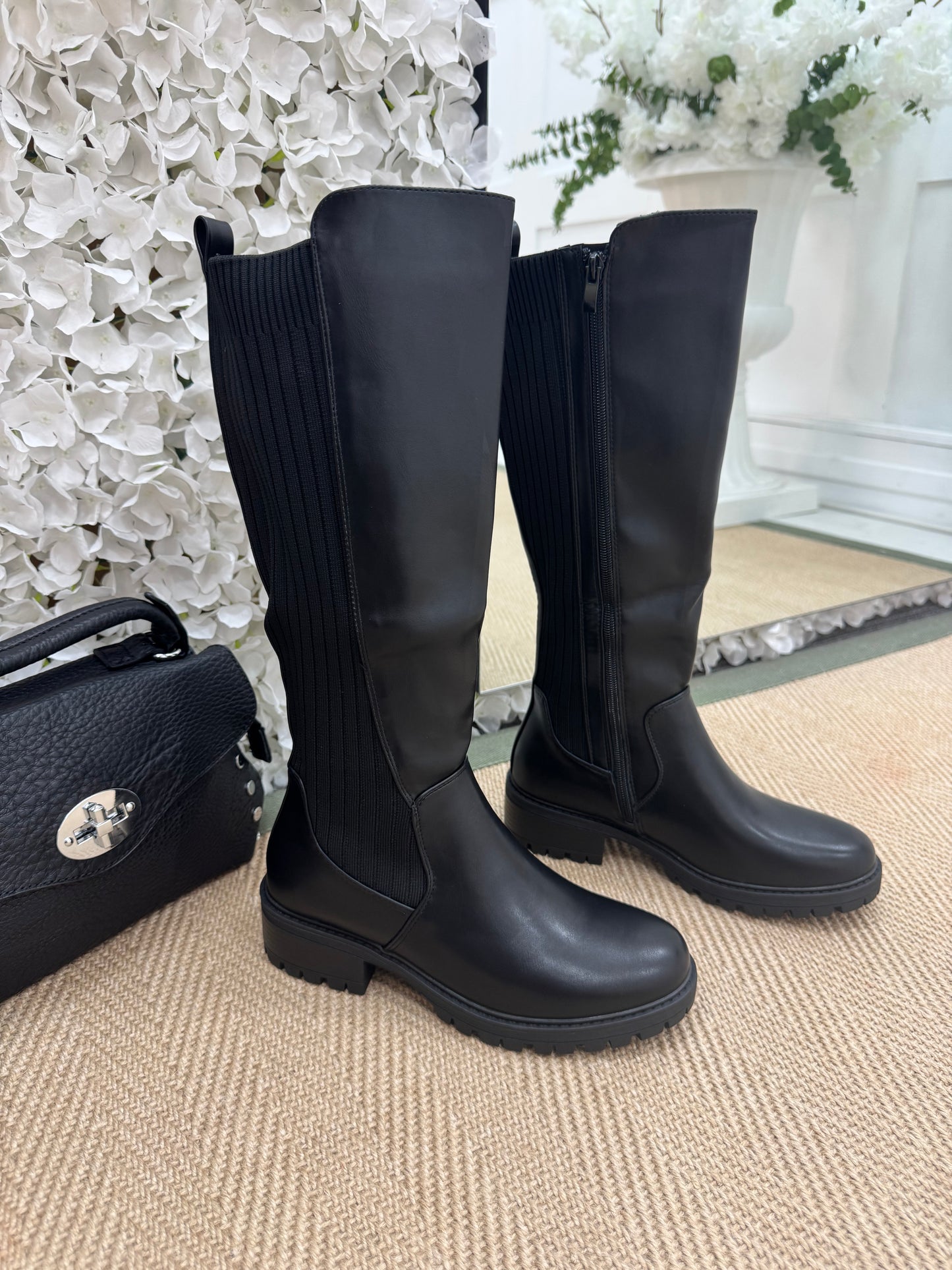 Trova Black stretchy knee high boots. Sizes: 3-8