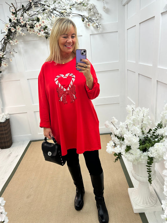 Candice: Red candy cane oversized top. One size: 16-20