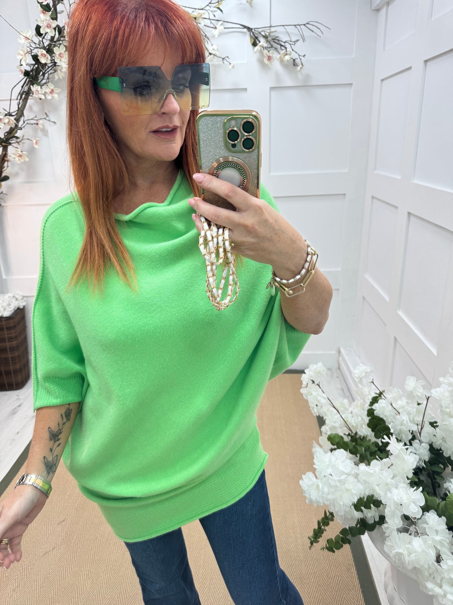 Samantha: Vibrant green asymmetrical slouch top. One size 10-18