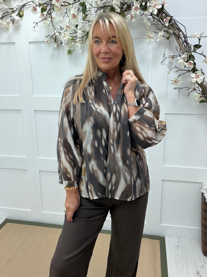 Brea: Brown animal print sheer blouse. One size: 12-18