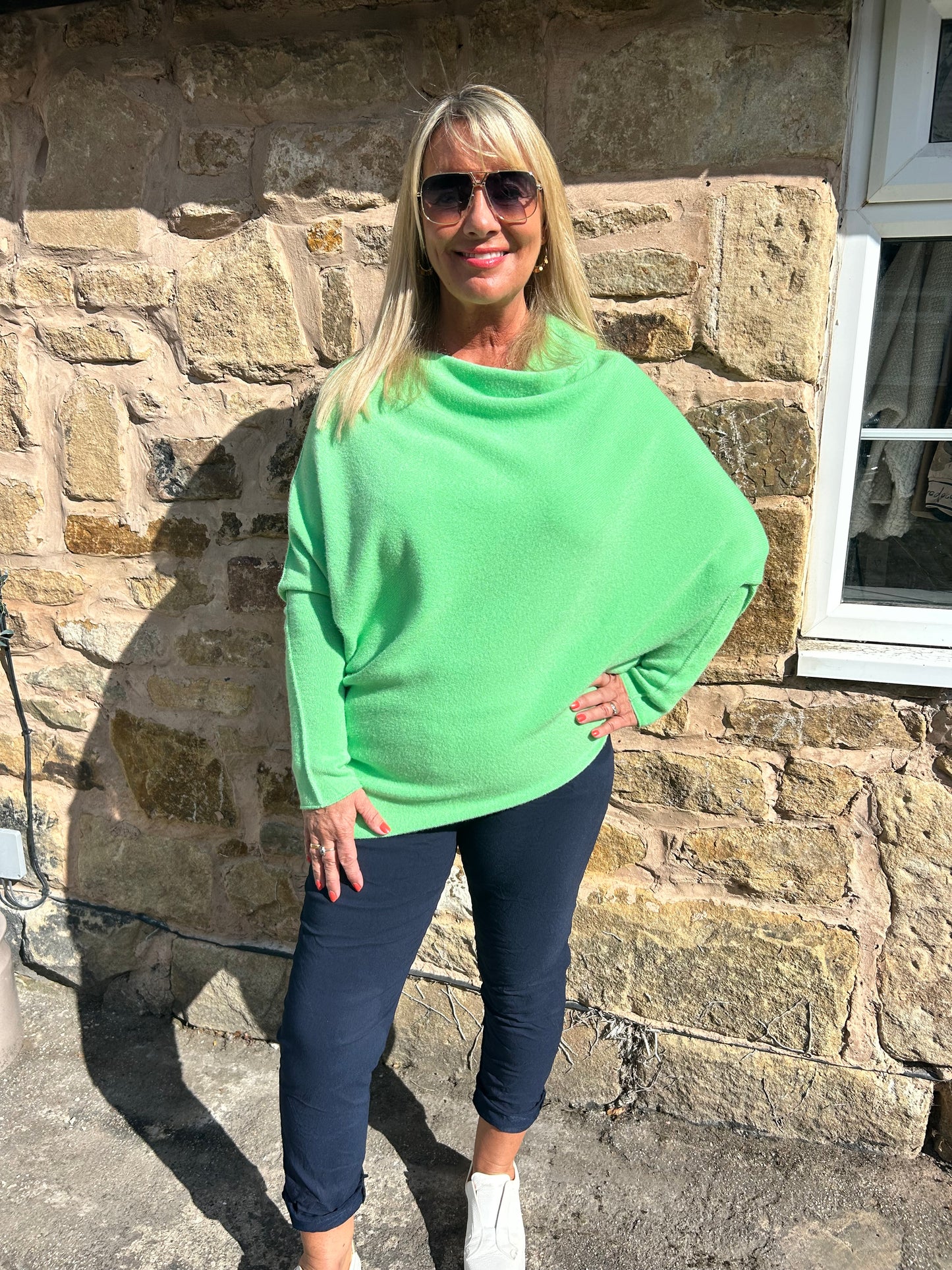 Marcie: Neon lime asymmetrical plain slouch soft knit top. One size 10-18
