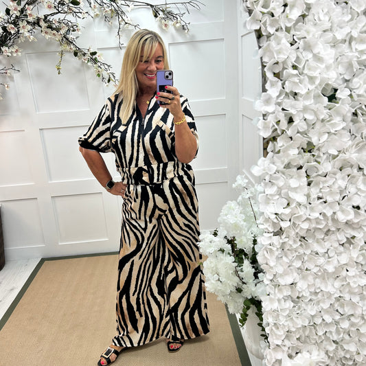 Aven: Black zebra print wide leg trousers. One size: 10-16