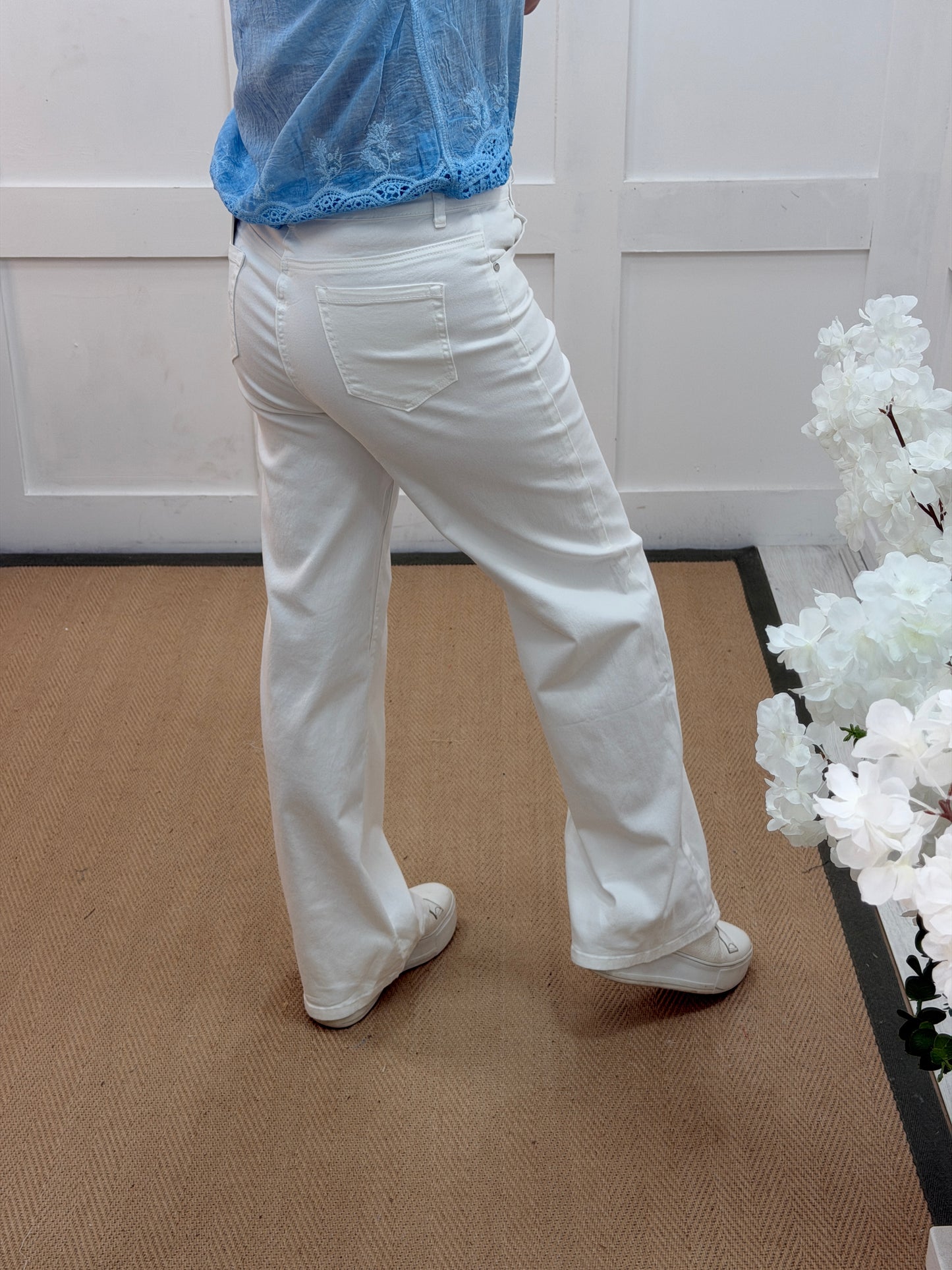 Libby: White high waist wide leg stretchy jeans. Sizes: 10-20