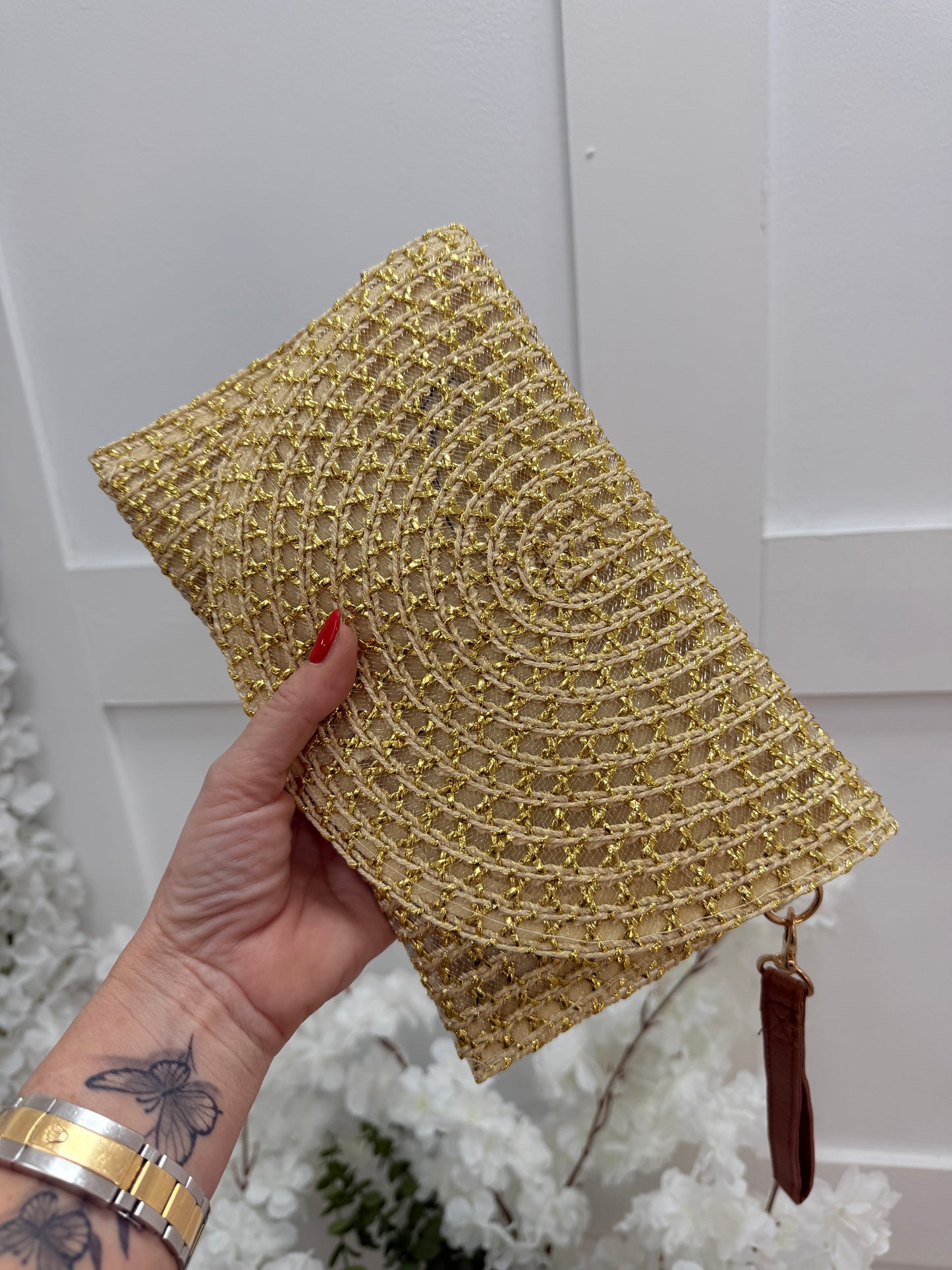 Solara: Gold raffia wristlet clutch bag
