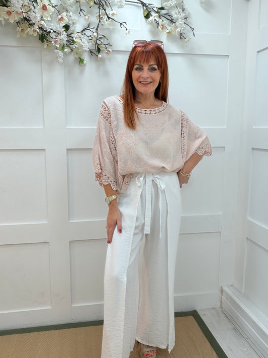 Carla: Pink embroidered floral batwing top. One size: 10-18