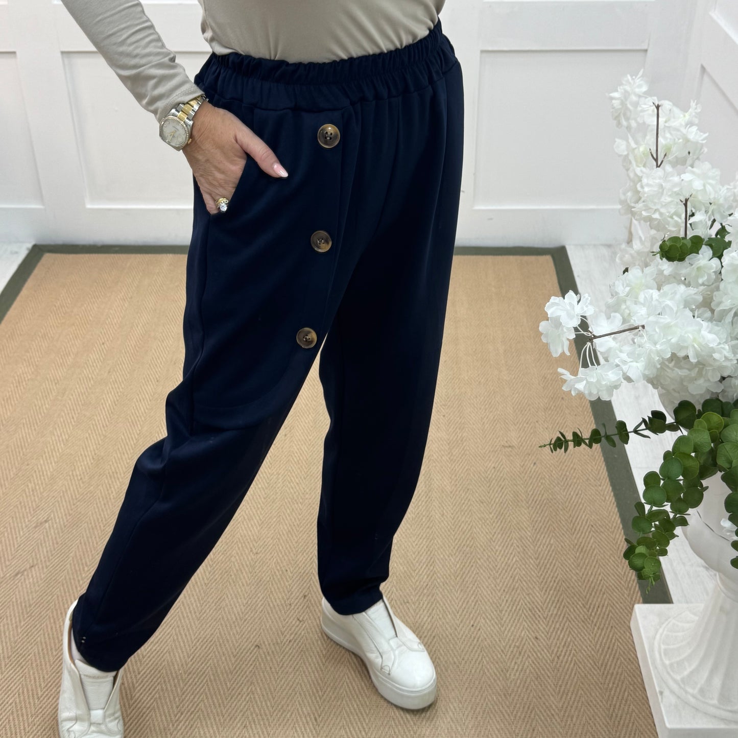 Monroe: Navy stretchy button trousers. One size: 12-18