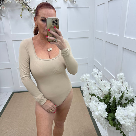 April: Sand stretchy waist cinch bodysuit. 2 sizes