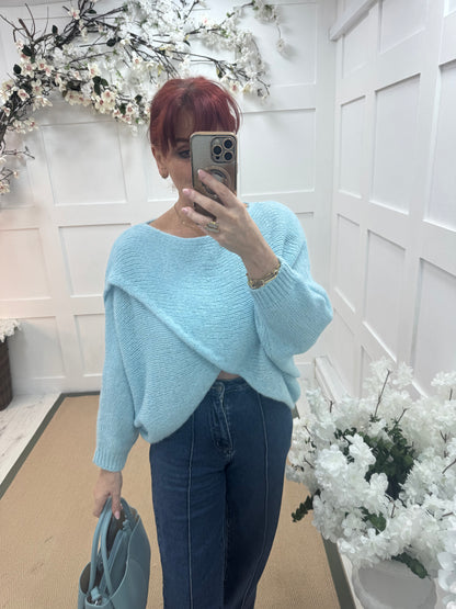 Willow: Light blue stretchy short wrap top. One size: 10-18