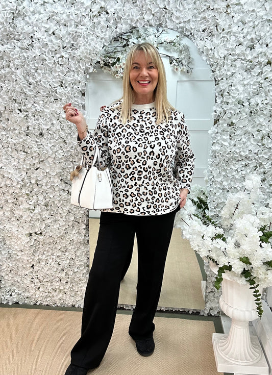 Mimi: Cream leopard print long sleeve knit top. One size: 12-16