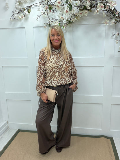 Luetta: High neck animal print blouse. One size: 12-18