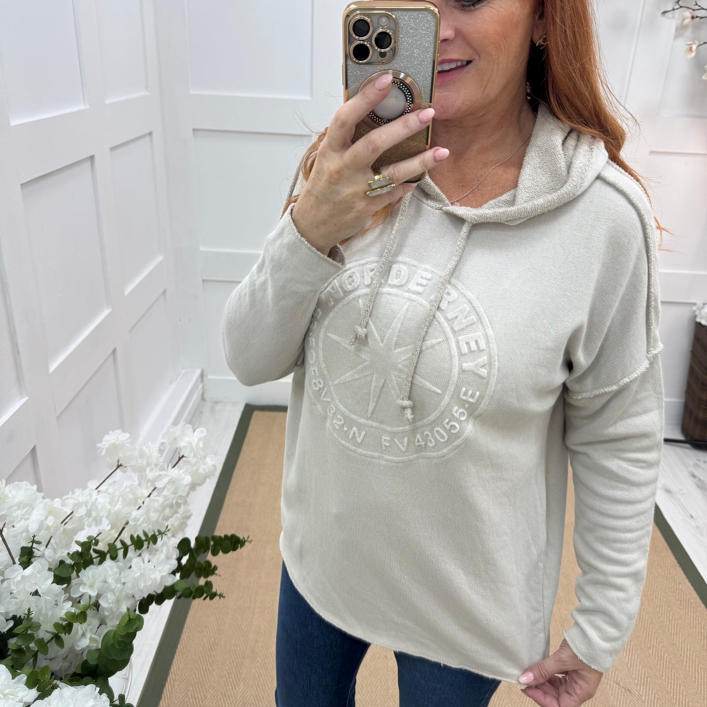 Sara: Cream hooded embossed compass top. One size: 12-18