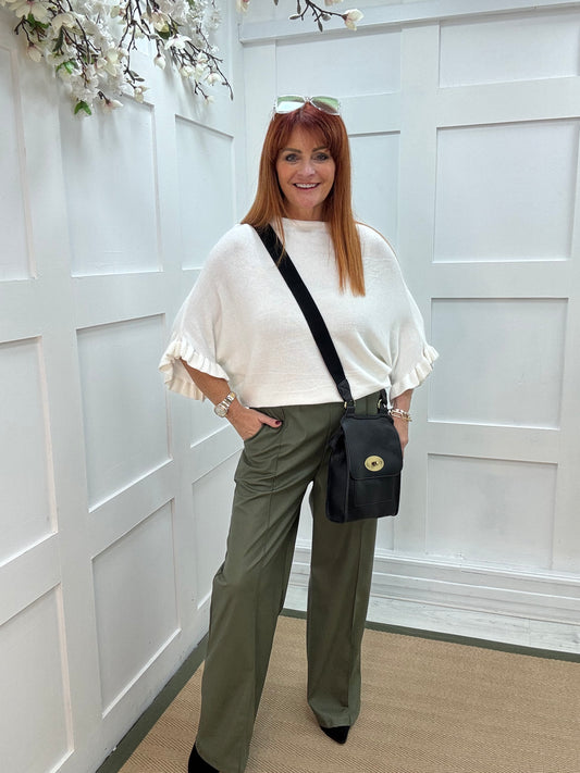 Sierra: White batwing fluted sleeve knitted top. One Size 12-18/20