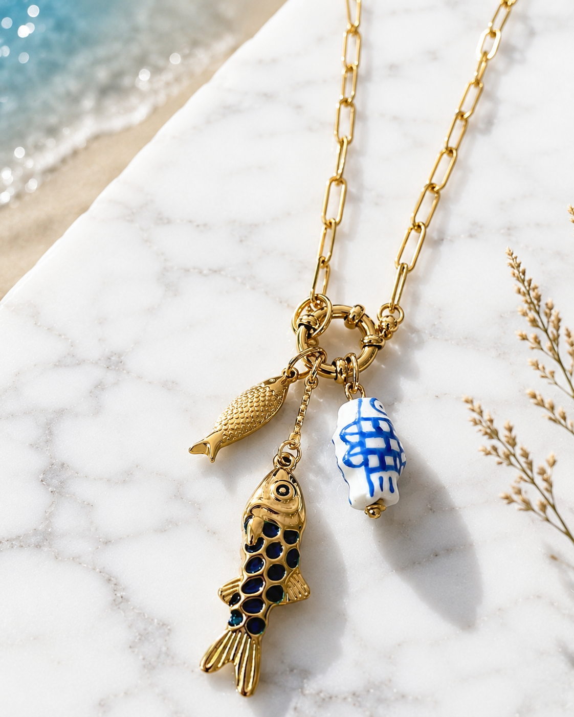 Dory: 18k gold plated multi fish necklace.
