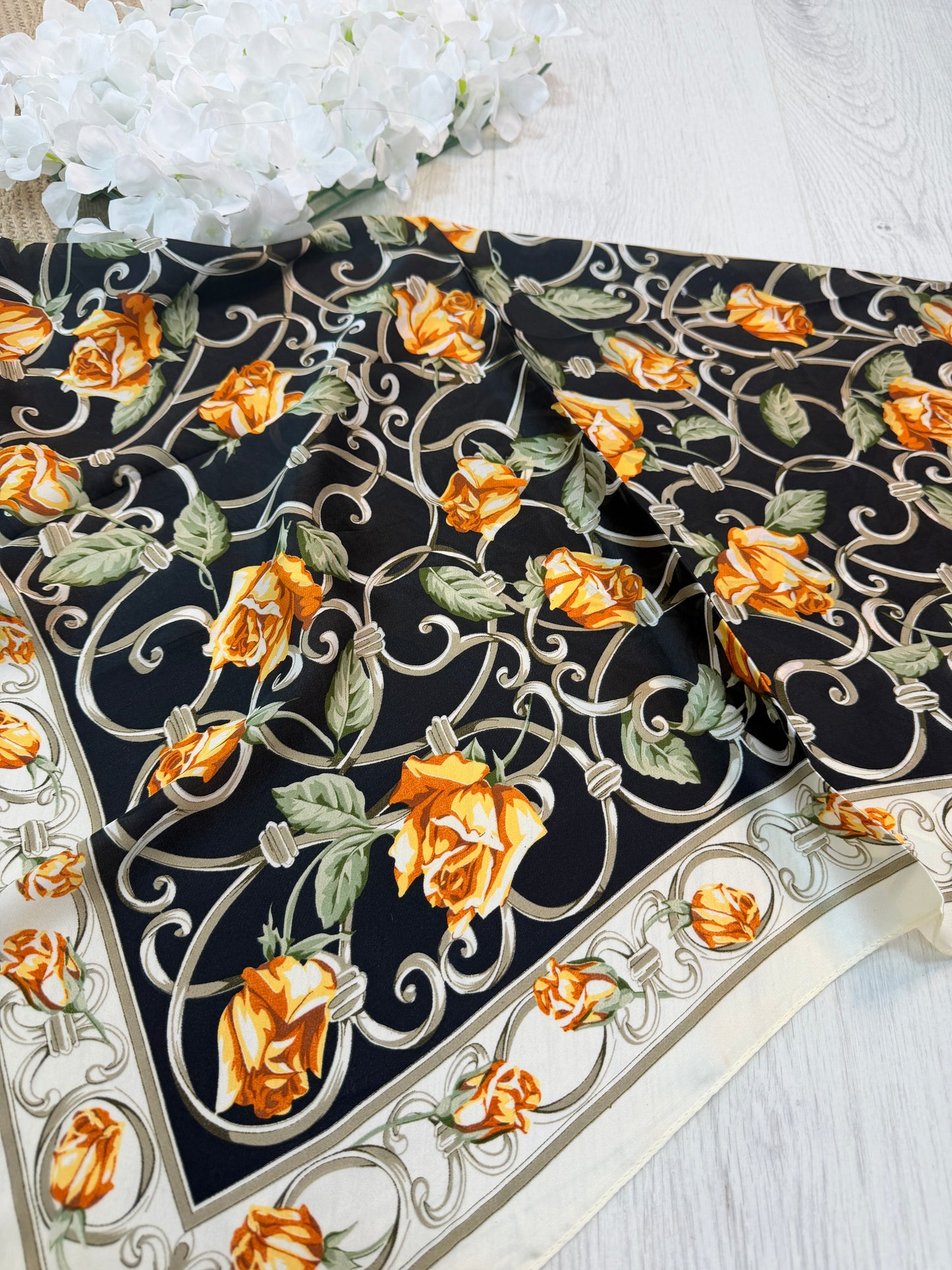 Rona: Black & orange rose  print silky neck scarf.