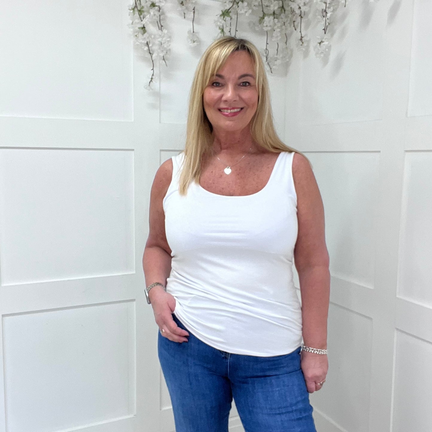 Abigail: Stretchy basic white vest top. 2 sizes