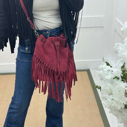 Athena: Burgundy real suede fringe cross body bag.