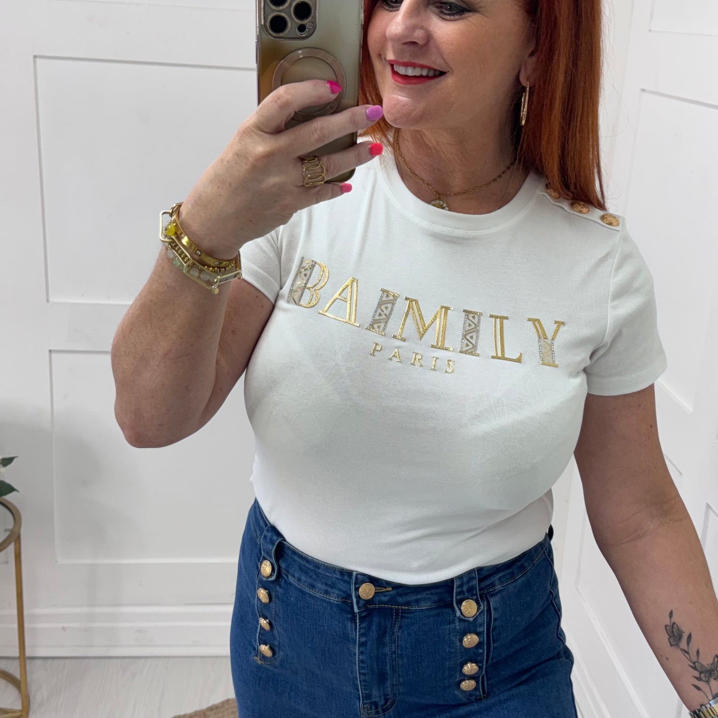 Briana: White gold script logo T shirt. 2 sizes