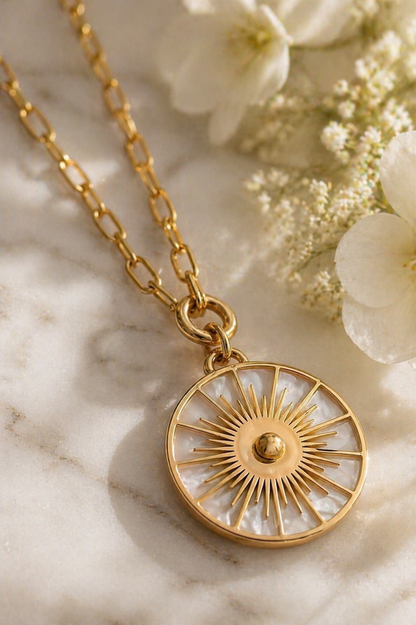 Solique: Gold mother of pearl sundial necklace
