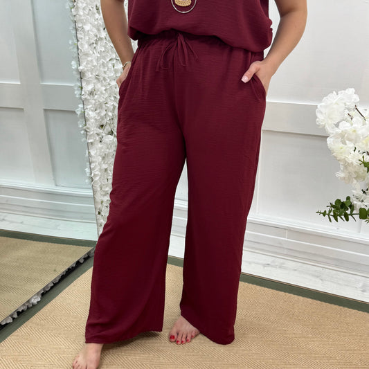 Esme: Burgundy pocket wide leg trousers. One size: 12-20