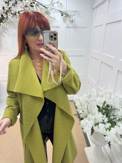 Kathie: Green boucle coat with pockets. One size 12-18