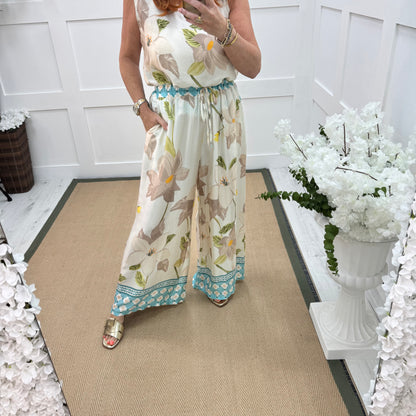 Bianca: Blue silky floral print wide leg trousers. One size: 10-16/18
