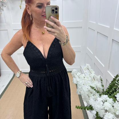 Bria: Black broderie Anglaise strappy jumpsuit. One size: 10-14