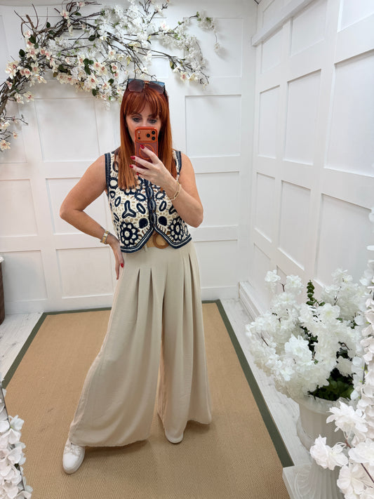 Gia: Cream wide leg belted trousers. One size: 10-16