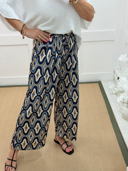Binnie: Blue wide leg patterned trousers. One size: 10-14
