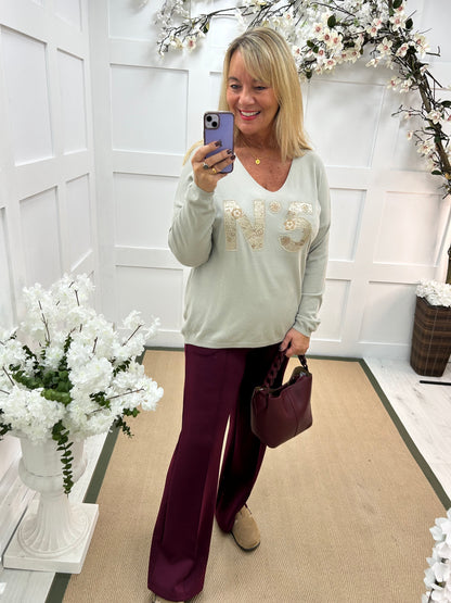 Cass: Stone V neck diamanté No5 knit top. One size: 14-20