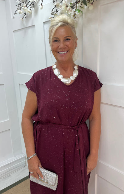 Gia: Burgundy sparkle tie-waist wide leg jumpsuit. One size: 12-18