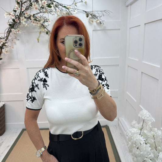 Henna: White stretchy knit embroidered top. 2 sizes