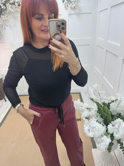 Romy: Black stretchy sheer mesh top. One size 12-18