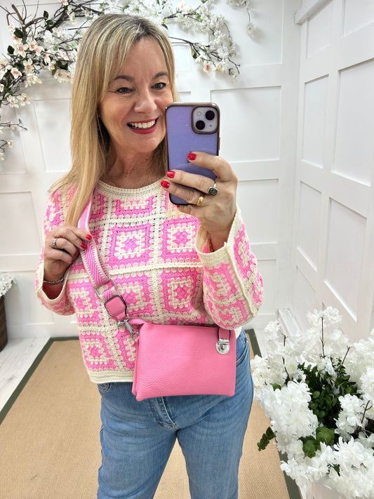 Britt: Candy pink three pocket crossbody bag.