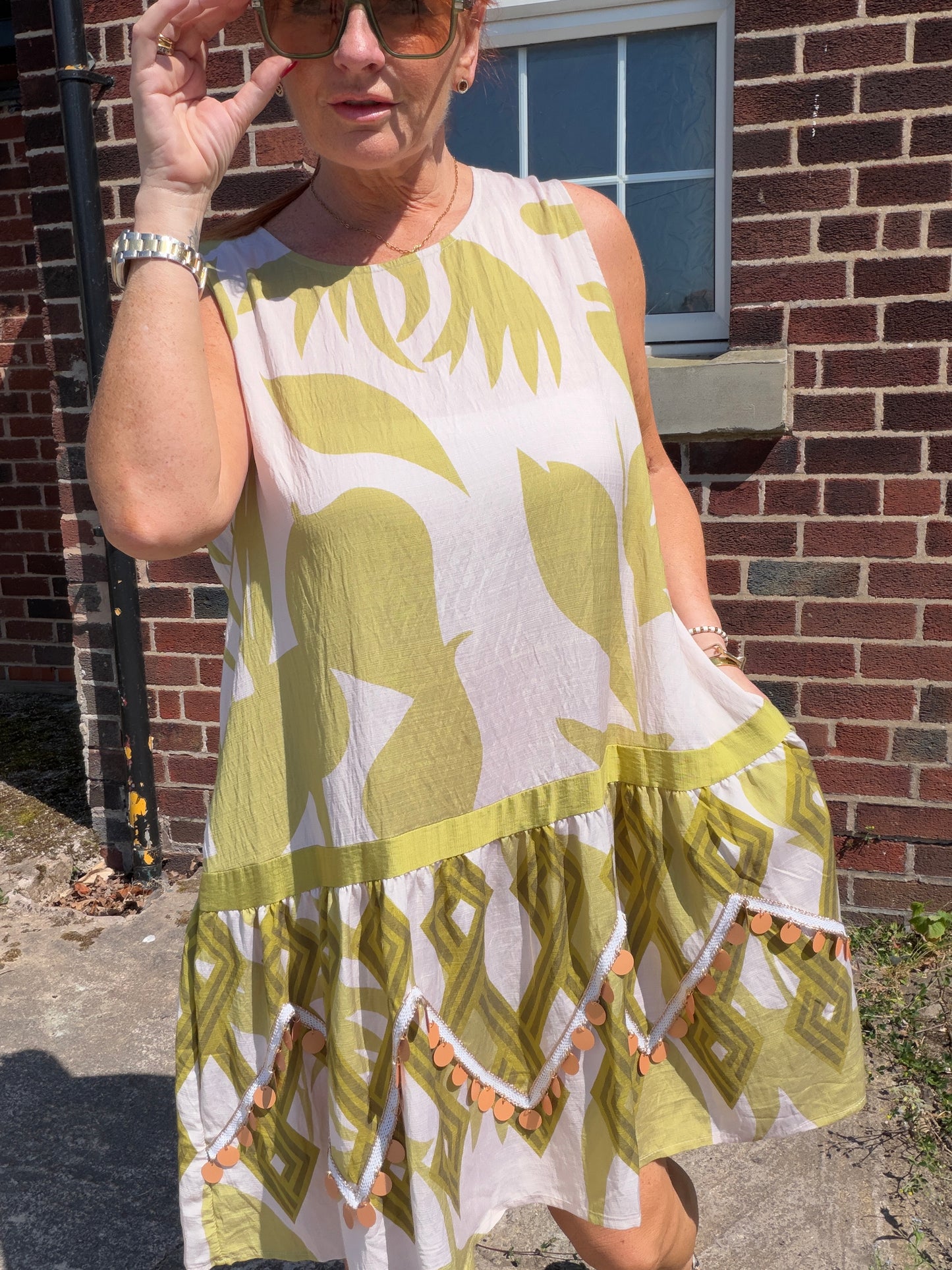Molly: Leaf printed midi dress with large disc detail. One size: 12-18. 2 colours