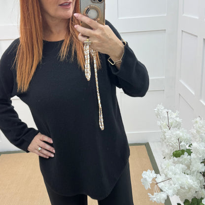 Mindy: Black plain long sleeve knit top. One size: 10-16/18