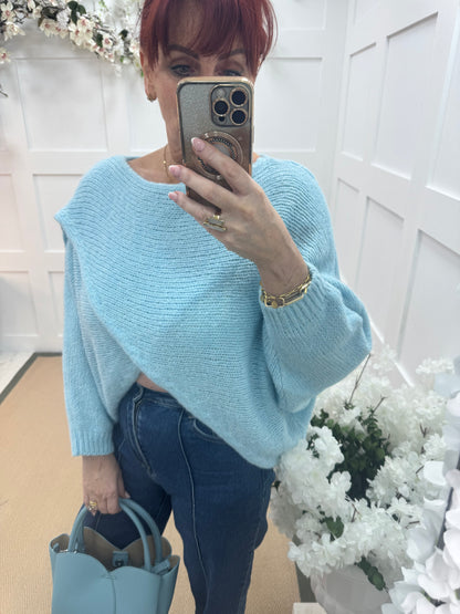 Willow: Light blue stretchy short wrap top. One size: 10-18