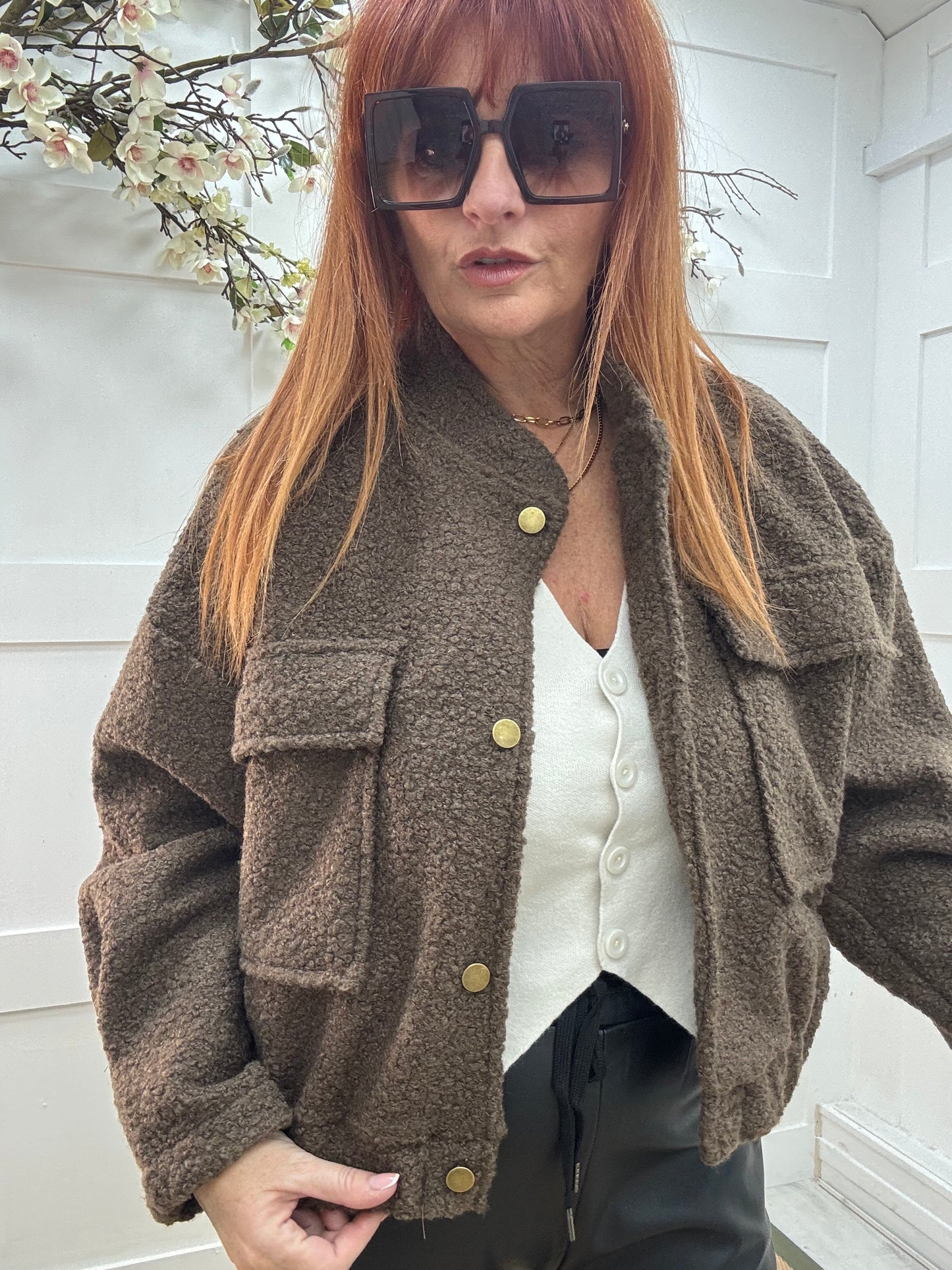 Kleo: Brown short boucle bomber jacket. One size: 12-18