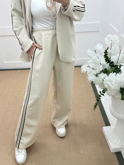 Libby: Cream stretchy sports stripe trousers. One size: 12-16