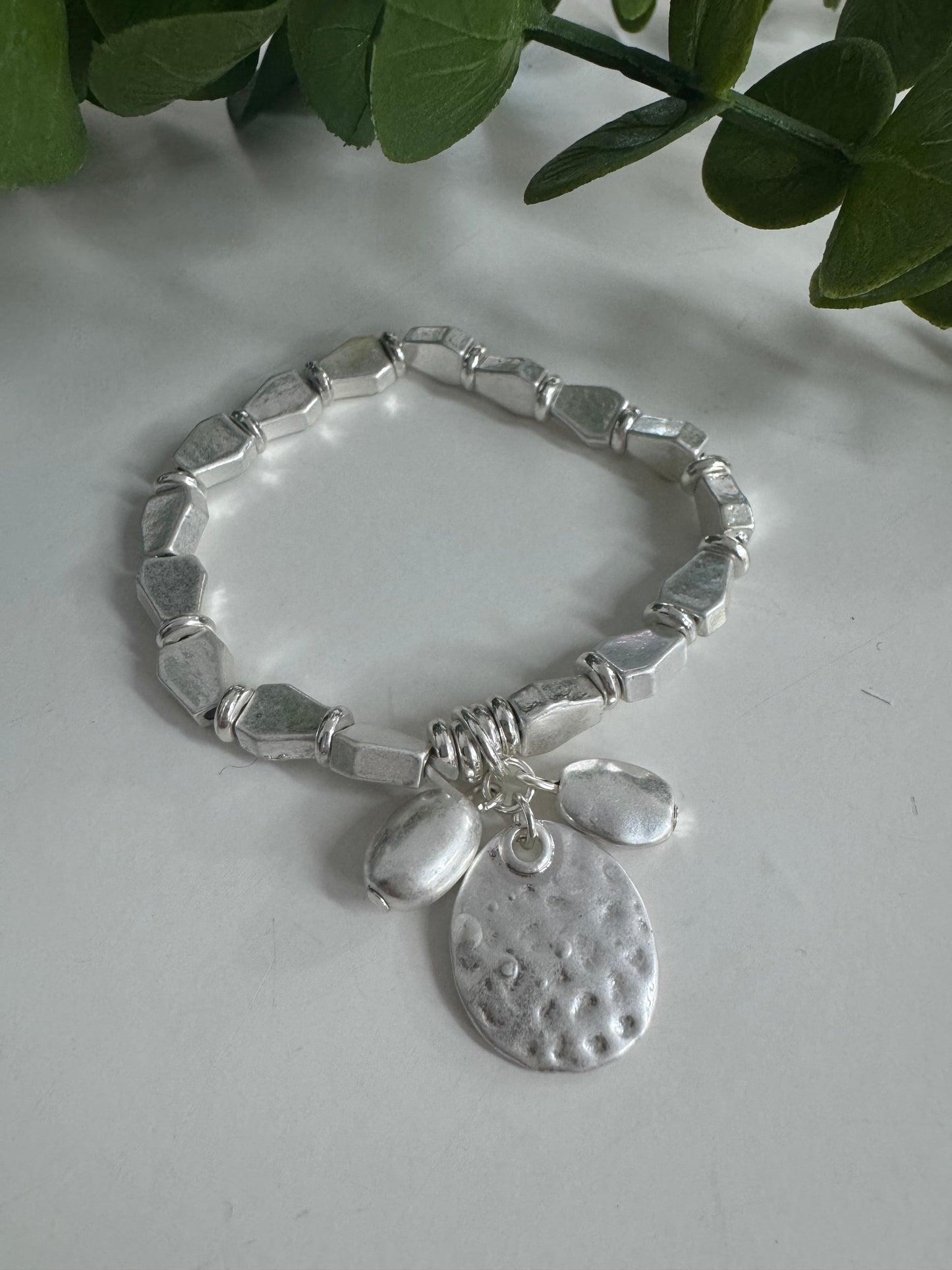 Shana: Silver metal charm bracelet