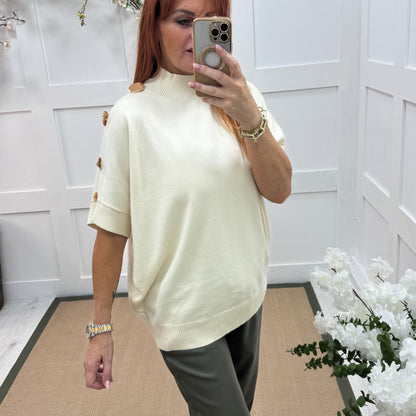 Camille: Cream short sleeve gold button top. One Size 12-20