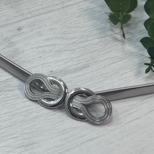 Mimi: Silver loop statement belt. One size: 8-18
