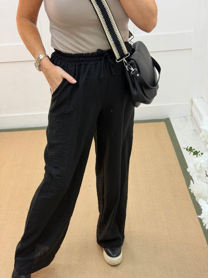 Leanne: Black wide leg trousers. One size: 10-14