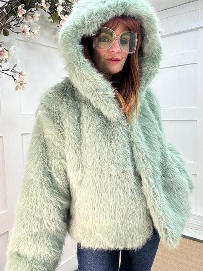 Foxy: Mint green short faux fur hooded jacket. One size 12-16