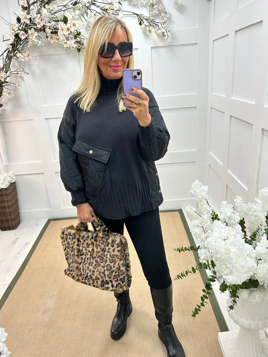 Harlo: Black quilted sleeve neck top. One Sz: 12-18