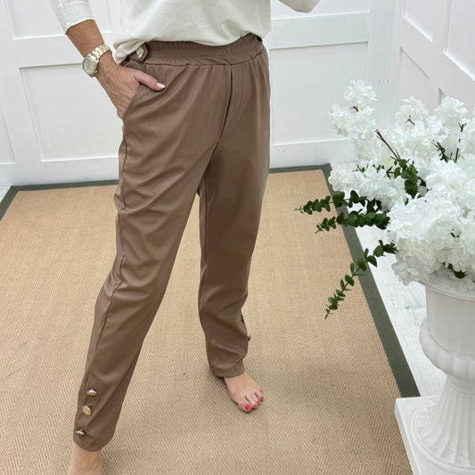 Tatum: Coffee faux leather button trousers. One size: 14-18