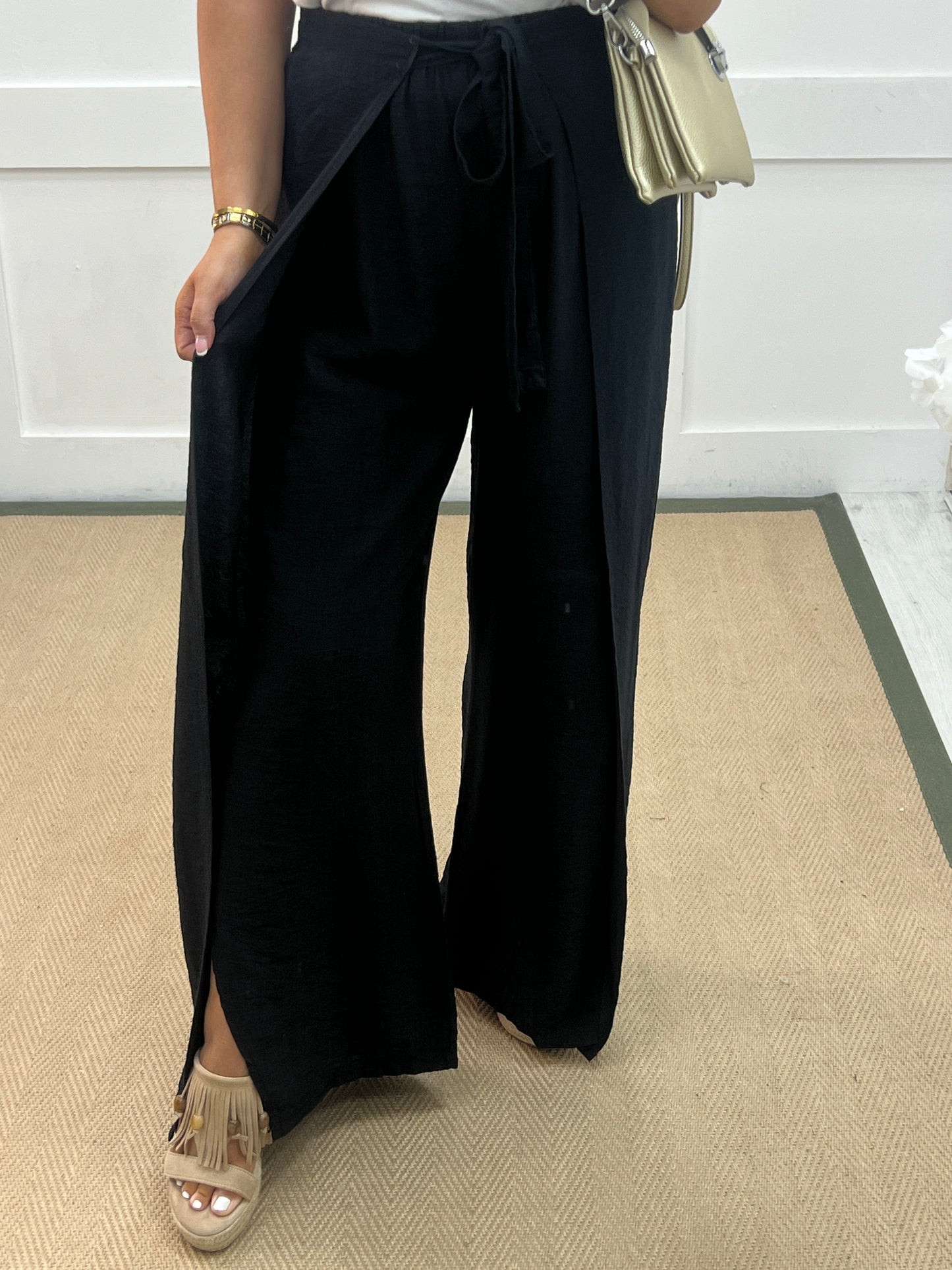 Eden: Black tie waist wide leg trousers. One size: 10-16